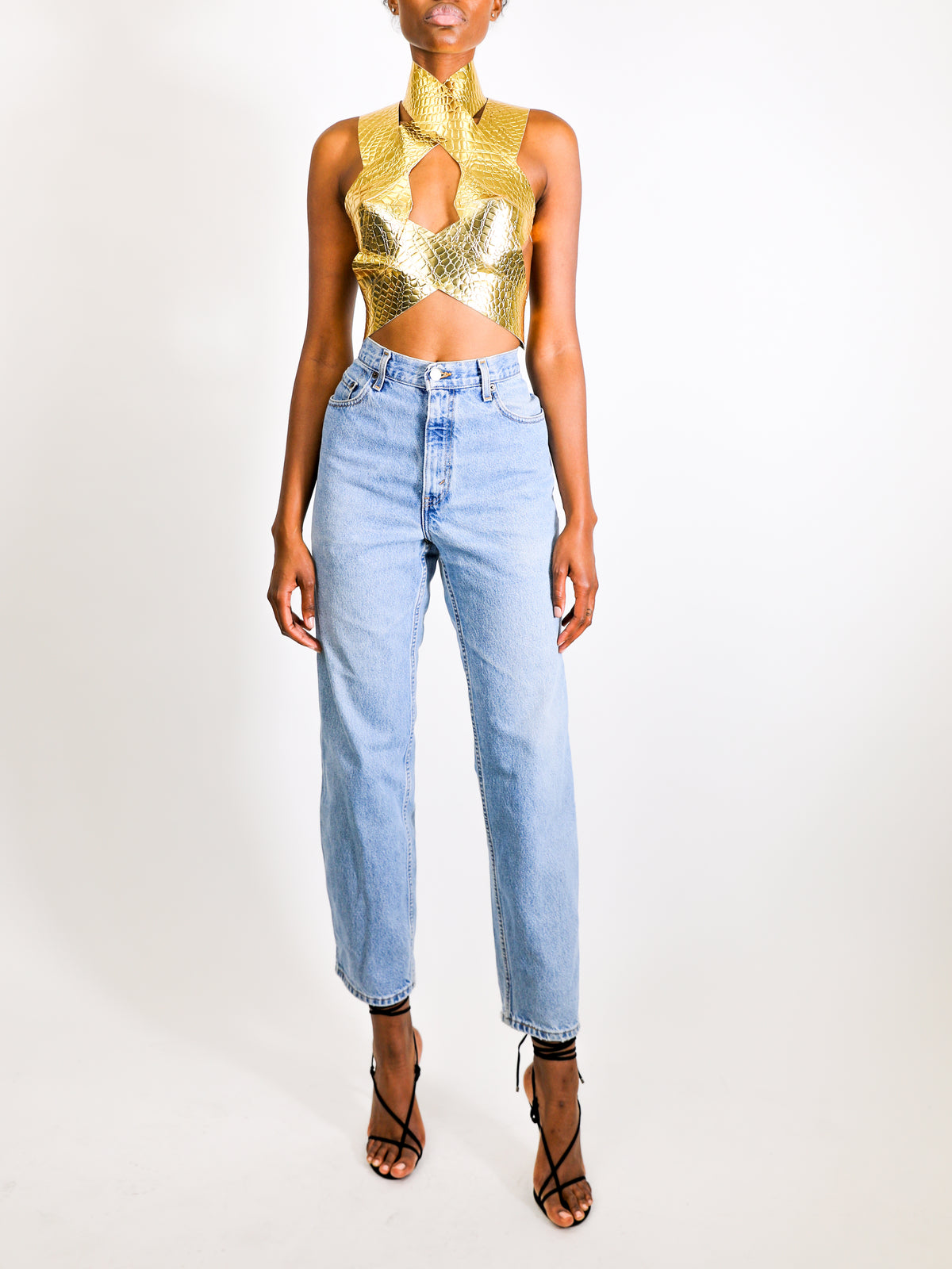 Model wears small Criss Cross Croc Top - Gold by GrayScale 